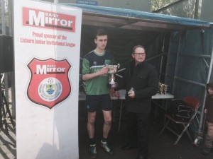16's Captain Callum Shields receives the runners-up Trophy from League Chairman Stanley Sheppard