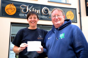 Kim from Kim On In, Downpatrick presents a cheque to Eugene Milligan