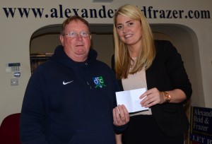 Secretary Eugene Milligan receives a sponsorship cheque from Mary-Lou Press the manager of Alexander, Reid & Frazer Estate Agents, Downpatrick.