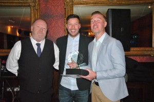 2nds Team Captain Neil Young accepts the Manager's Player of the Year Award on behalf of the winner Paul O'Reilly